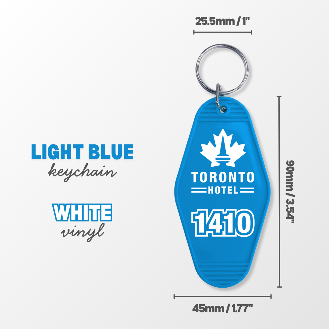 Light blue keychain with white vinyl, featuring 'Toronto Hotel 1410' text and a maple leaf symbol, with measurements on a white background.